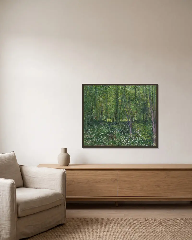 Trees and undergrowth av Vincent van Gogh inramad på en vägg
