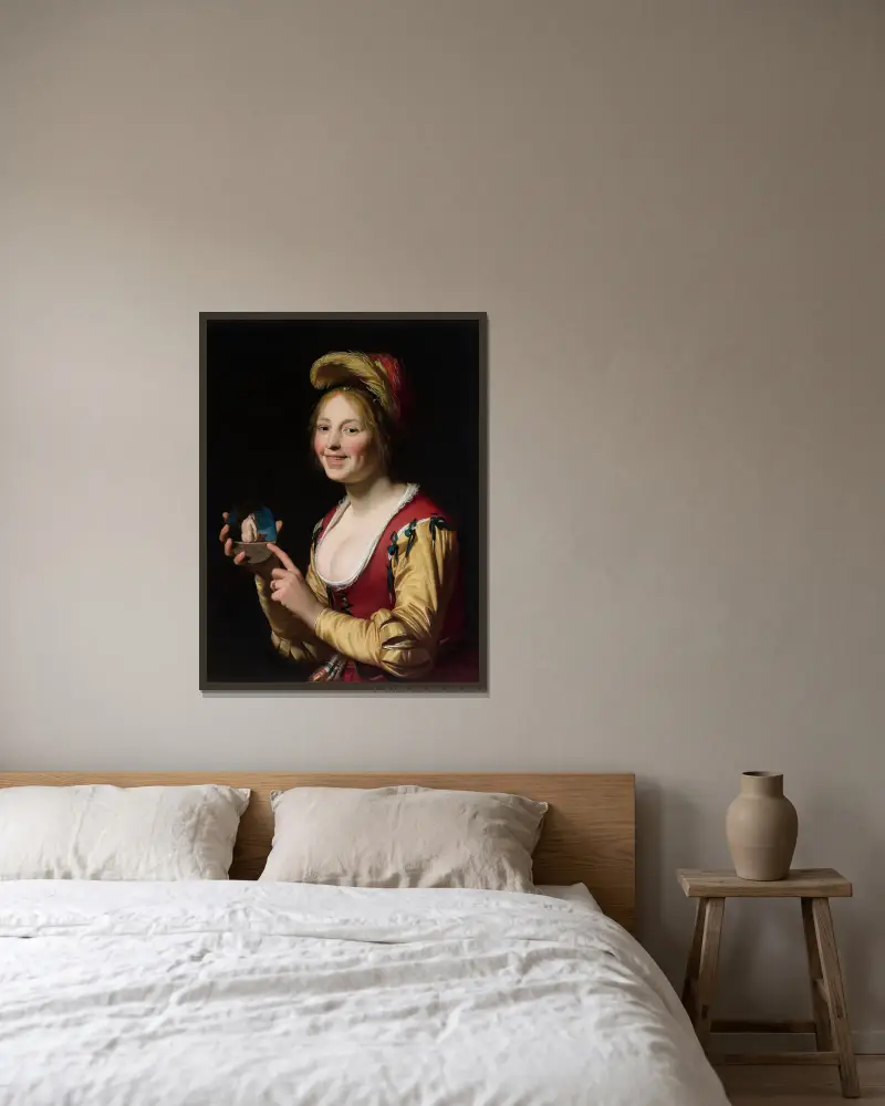 Lächelndes Mädchen, eine Kurtisane, ein unzüchtiges Bild haltend von Gerard van Honthorst gerahmt an einer Wand