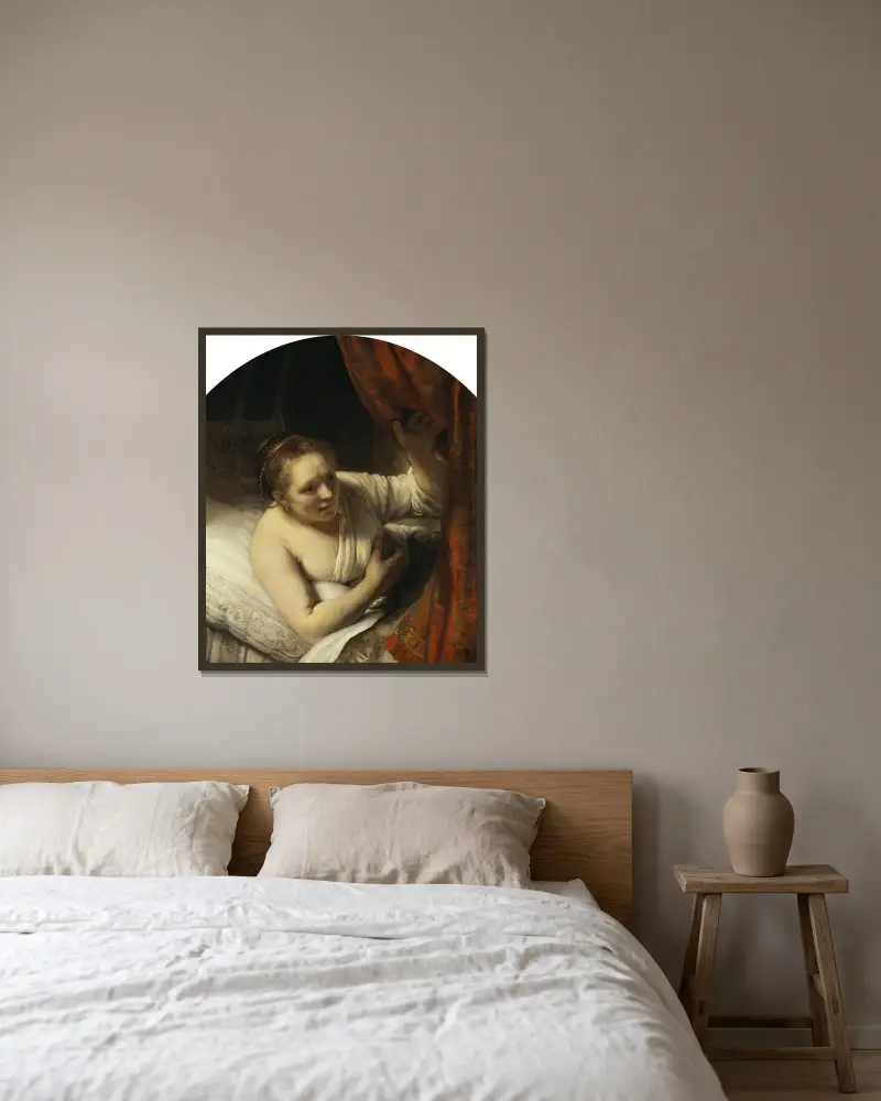 A Woman in Bed av Rembrandt van Rijn inramad på en vägg