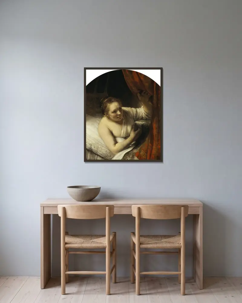 A Woman in Bed av Rembrandt van Rijn inramad på en vägg