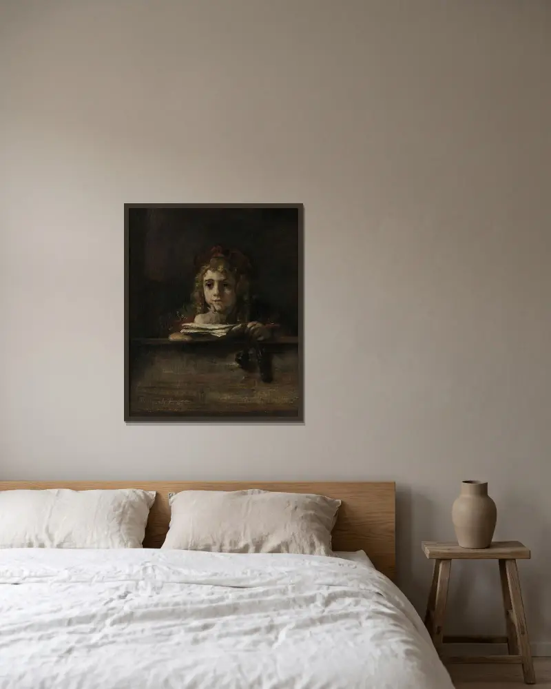 Titus am Schreibtisch von Rembrandt van Rijn gerahmt an einer Wand