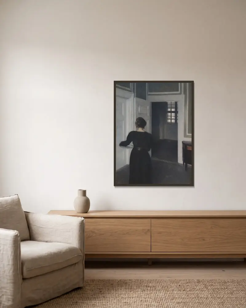 Ida In An Interior av Vilhelm Hammershøi inramad på en vägg