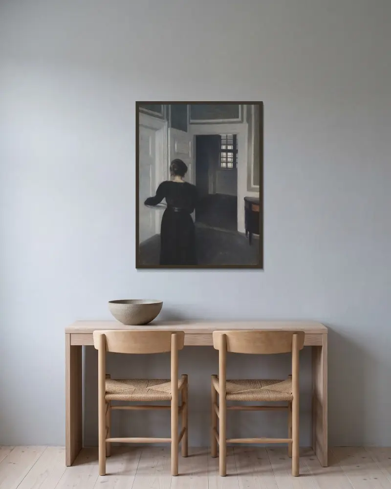Ida In An Interior av Vilhelm Hammershøi inramad på en vägg
