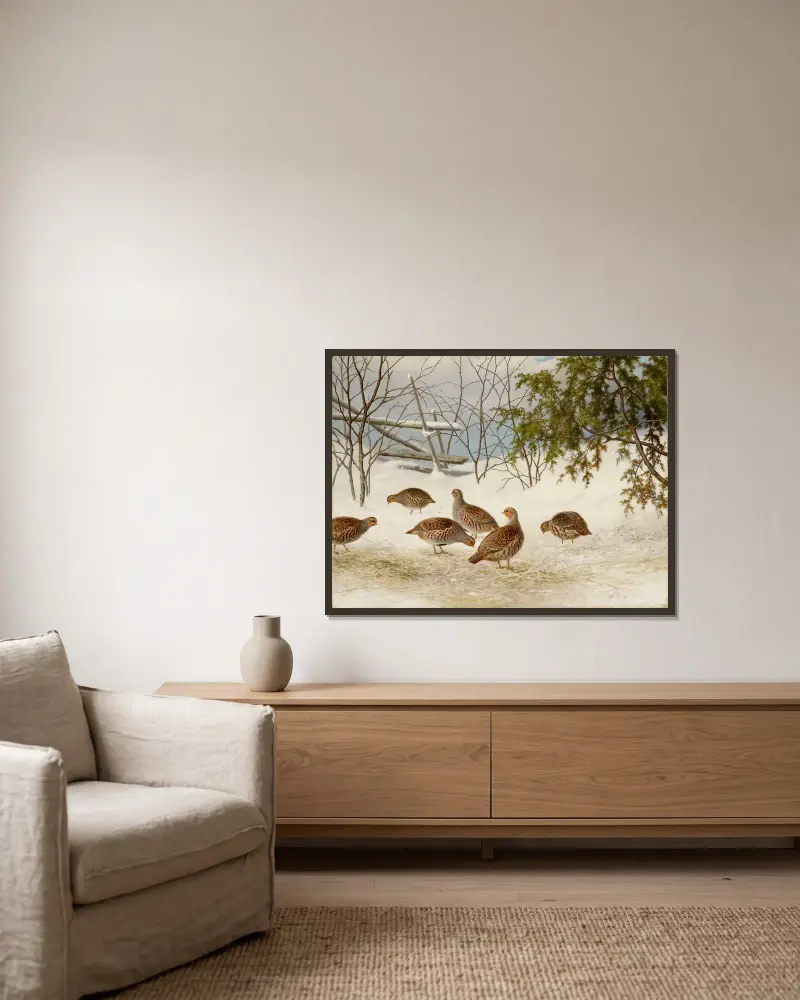 Partridges In Snow av Ferdinand von Wright inramad på en vägg