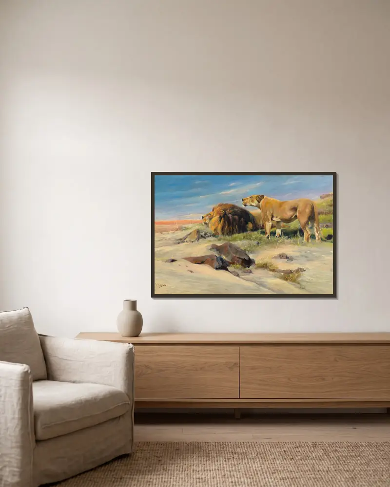Löwenpaar in der Steppe von Wilhelm Kuhnert gerahmt an einer Wand