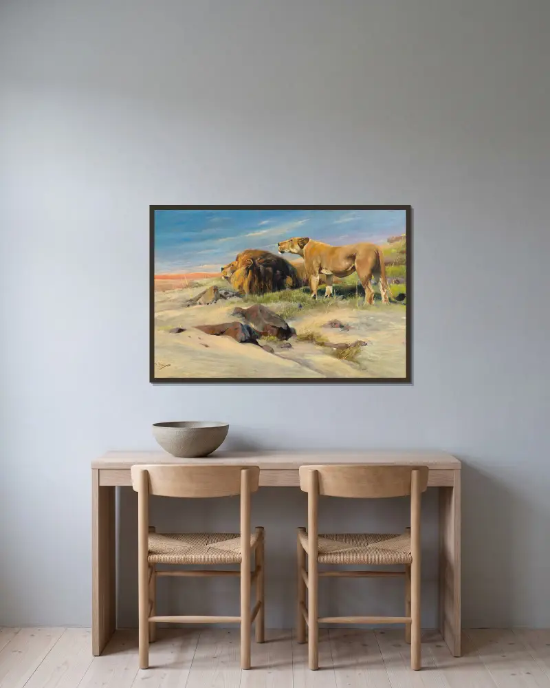 Löwenpaar in der Steppe von Wilhelm Kuhnert gerahmt an einer Wand