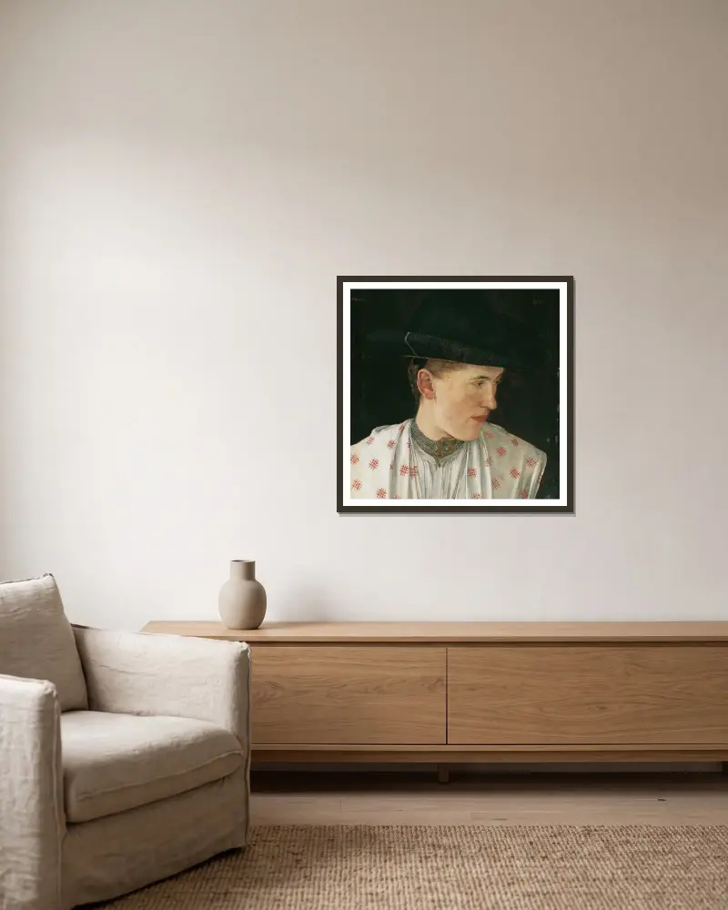 Kopf eines Bauernmädchens von Wilhelm Leibl gerahmt an einer Wand