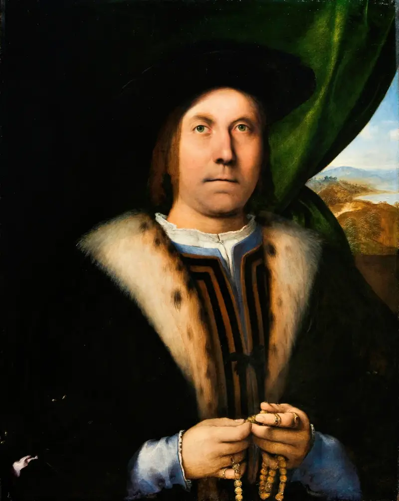 Porträtt av en man med radband av Lorenzo Lotto