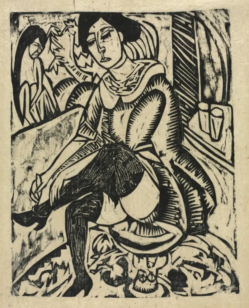 Kvinna som tar på sig sina skor av Ernst Ludwig Kirchner