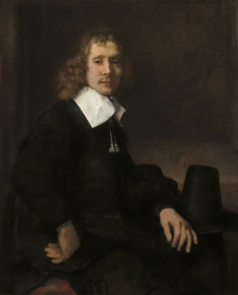 Junger Mann an einem Tisch (möglicherweise Govaert Flinck) von Rembrandt van Rijn