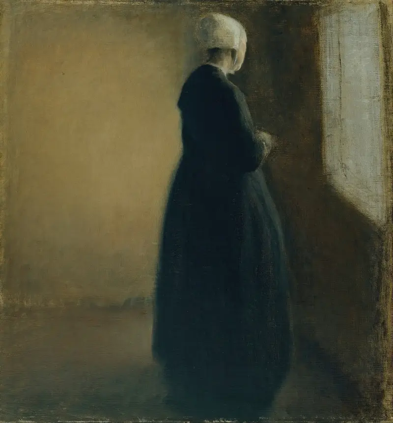 Gammal kvinna stående vid ett fönster av Vilhelm Hammershøi