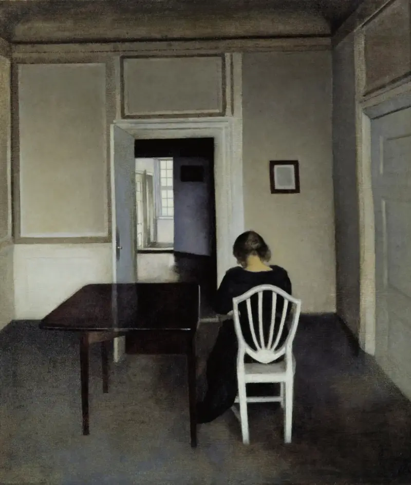 Interior With Ida in A White Chair av Vilhelm Hammershøi